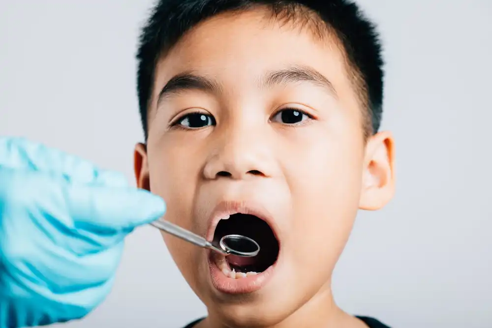 Paediatric dentist assessing a child’s lost tooth